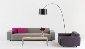 HM17L sofa in a grey fabric finish, shown with armchair and table